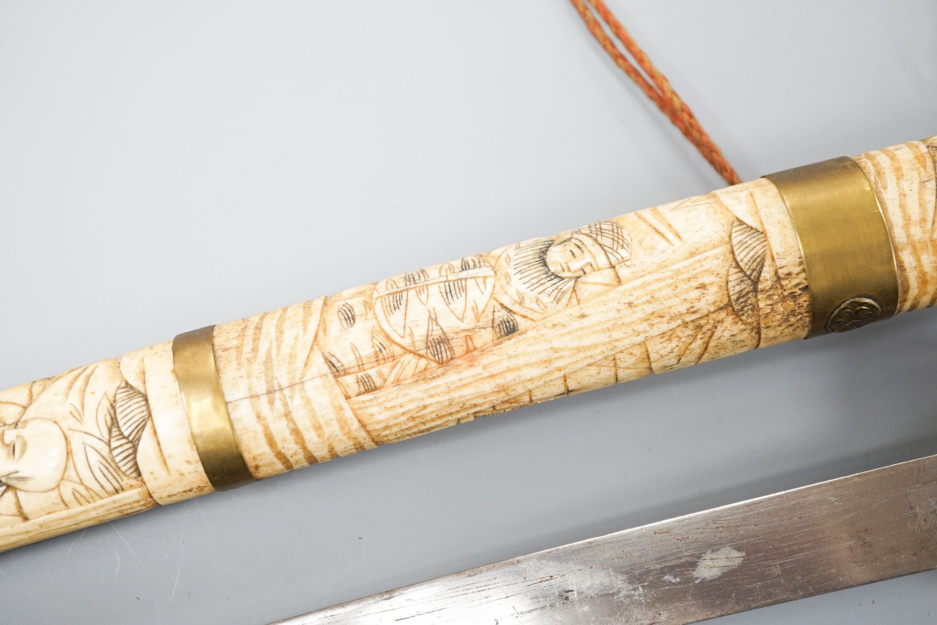 A 20th century bone and brass mounted tanto sword